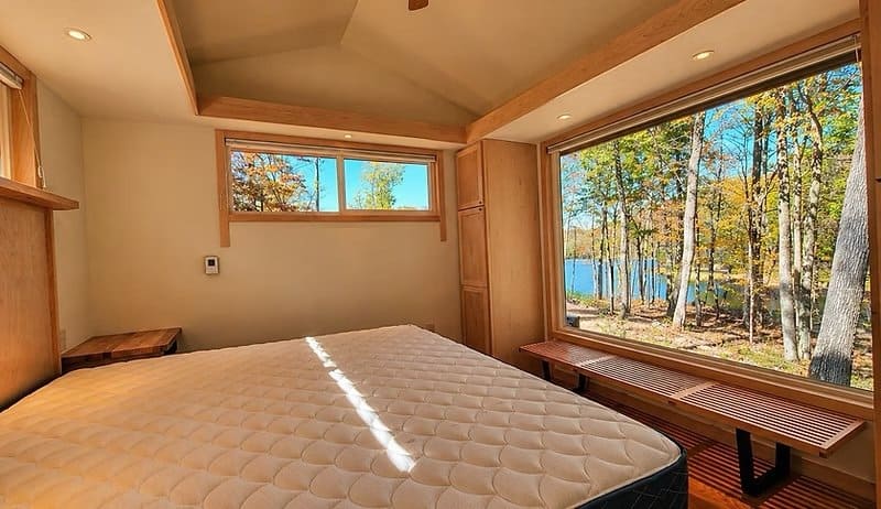 Enlarged king bedroom facing Lost Lake with a large picture window