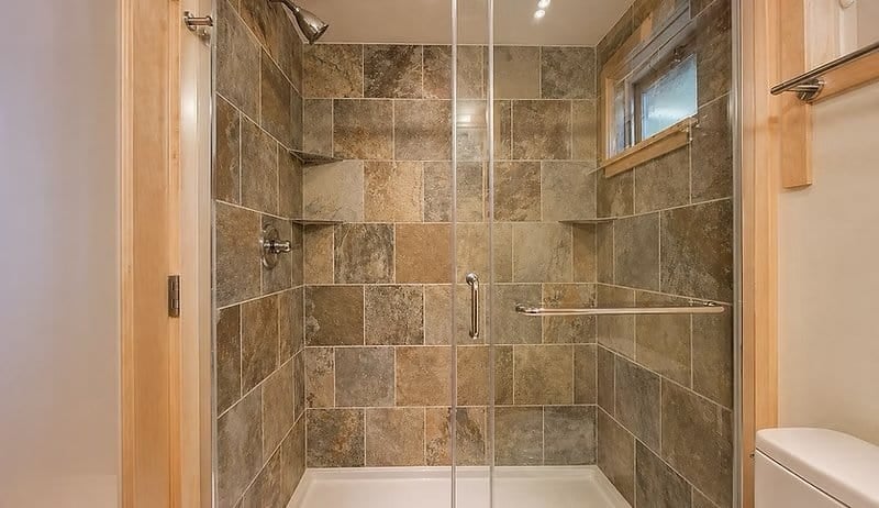 Spacious bathroom with a walk-in tile shower in the Shoreline Lot 19