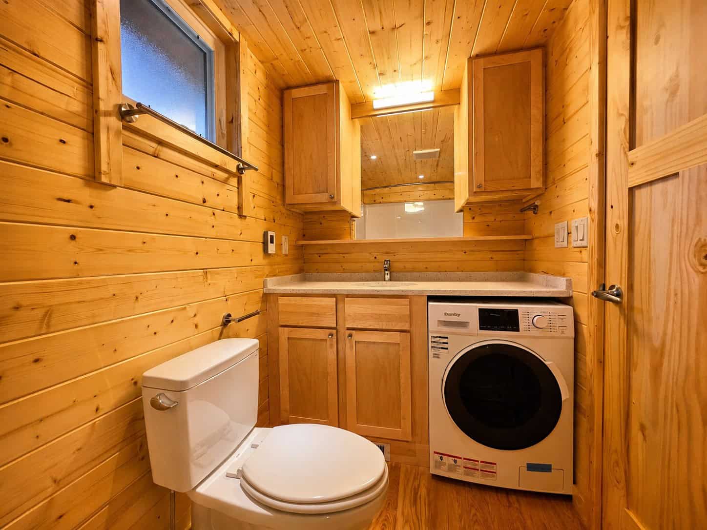 Full bathroom with vanity, toilet, and in-home washer at Shoreline Lot 24