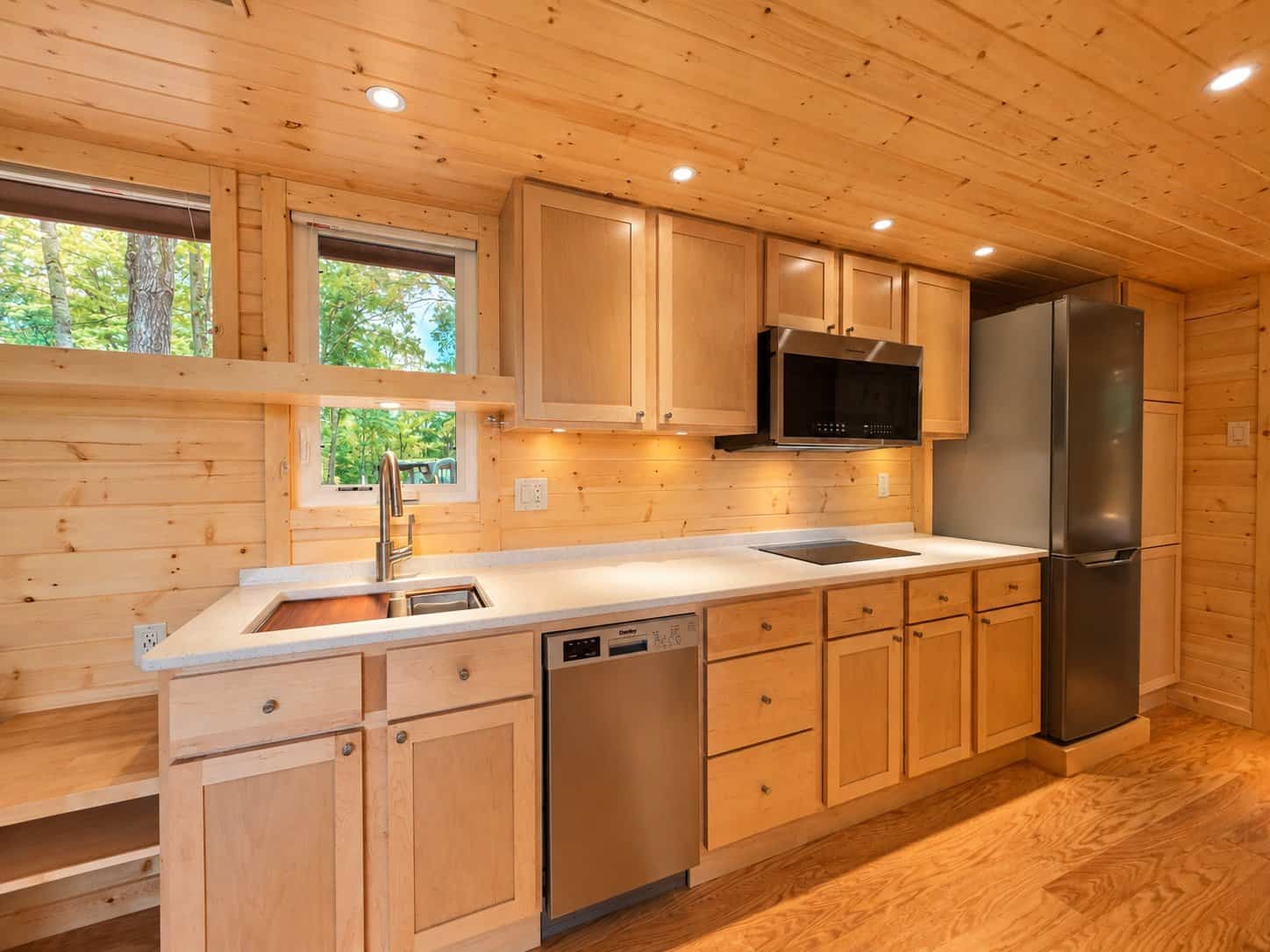 Upgraded quartz kitchen with induction cooktop in Shoreline XL Lot 26