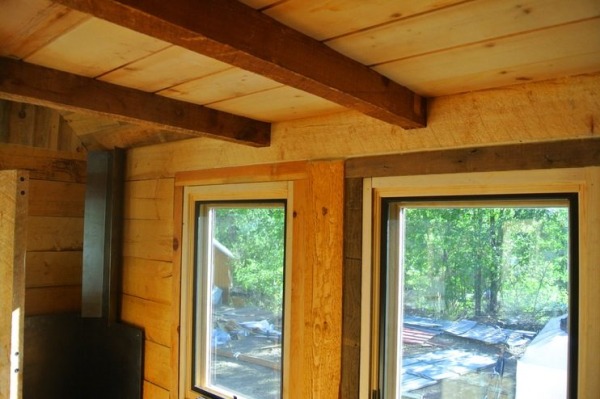 stanley-rocky-mountain-tiny-houses-log-cabin-on-wheels-flipping-overhangs-greg-parham-00014