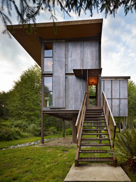 steel-clad-tiny-modern-cabin-with-shutters-on-stilts-04