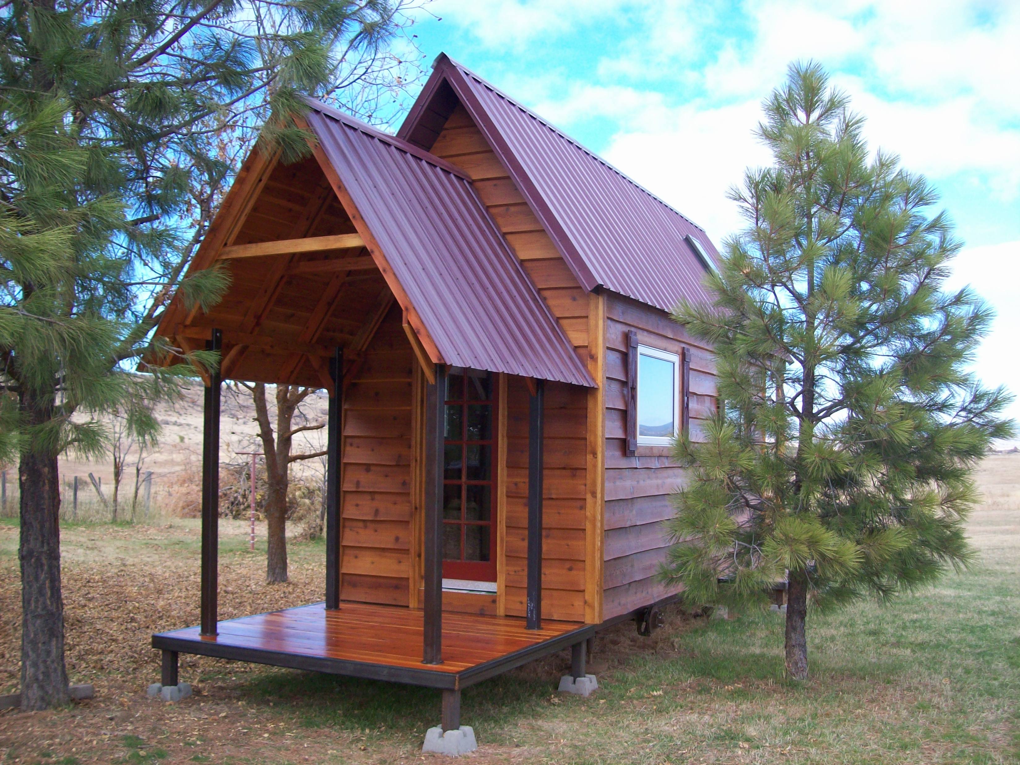 Tall Tiny House with a Porch and Loft