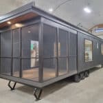 Tiny house with screened porch for outdoor living and relaxation.