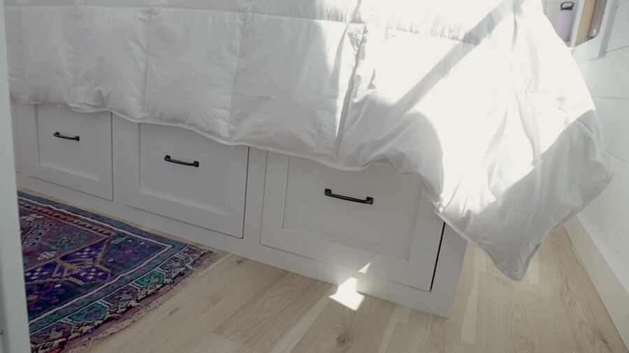 Built-in drawers beneath the bed in the main bedroom