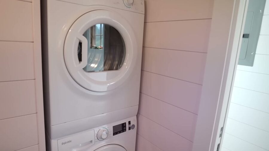 Stacked washer and dryer tucked into the bathroom corner