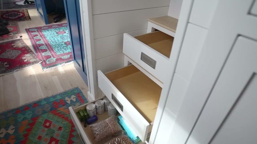 Storage stairs to the loft with deep built-in drawers