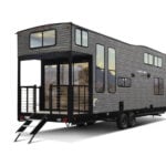 Modern tiny house trailer with large windows and a small porch for comfortable mobile living.