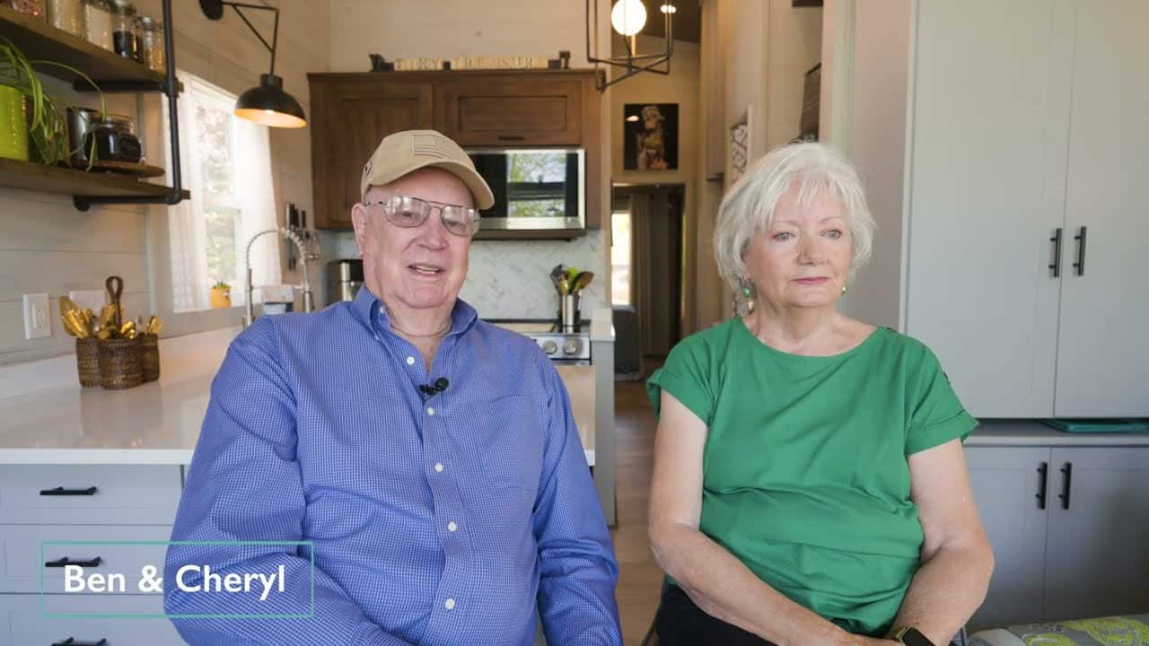Ben and Cheryl in the Tiny Treasure kitchen, TINY TREASURE on the cabinets