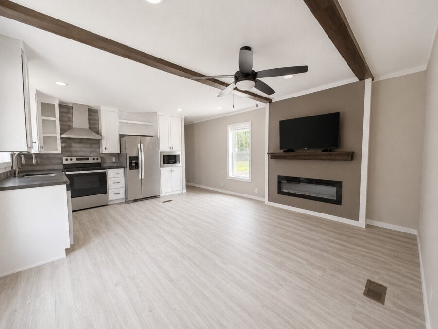 Tiny Life Urban 49478A open kitchen and living with fireplace wall and ceiling fan