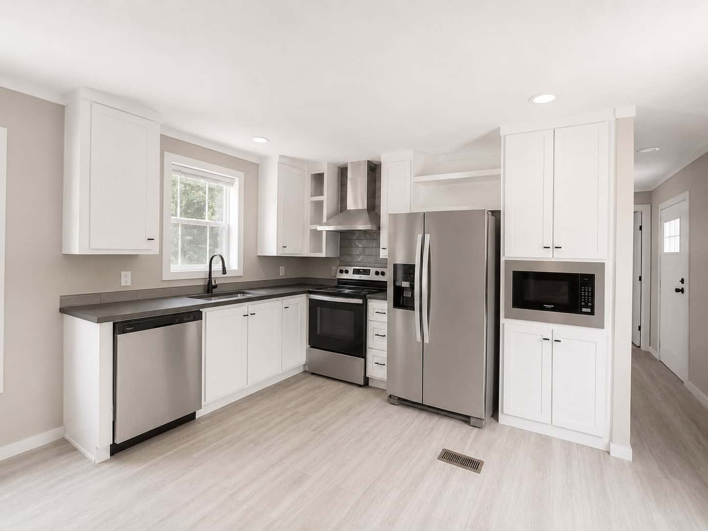 Tiny Life Urban kitchen: White Oak cabinets, steel counters, stainless appliances