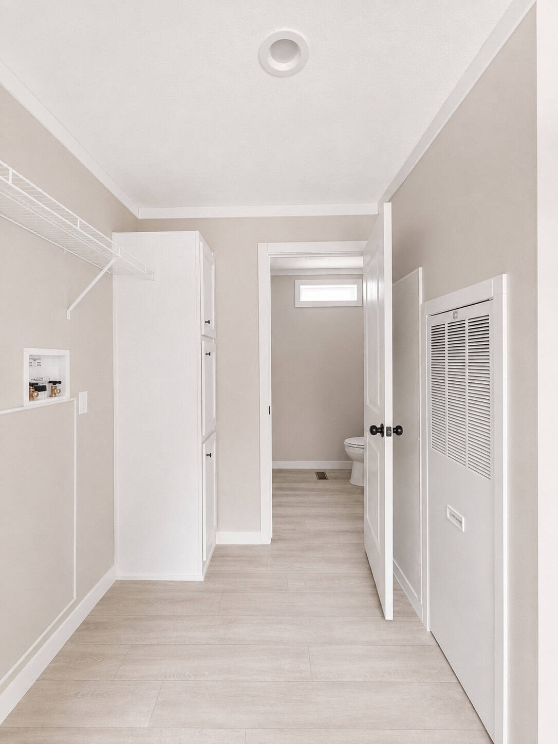 Tiny Life Urban laundry hookups and bath hall