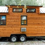 Securing a Tiny House on Wheels After Parking With Tire Locks for the Trailer Tires