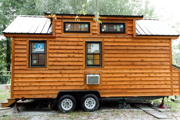 Securing a Tiny House on Wheels After Parking With Tire Locks for the Trailer Tires