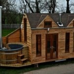 Mobile Tiny Cabin Built on a Trailer with Hot Tub for Glamping