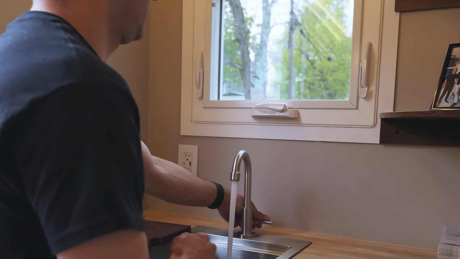 Running water at the Uplift Micro Home sink, fed by the onboard freshwater tank