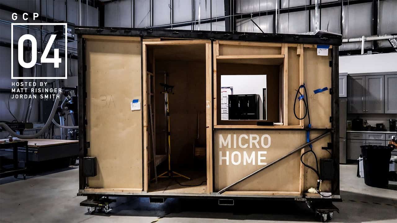 Uplift Micro Home shell open on the shop floor showing the interior layout under construction