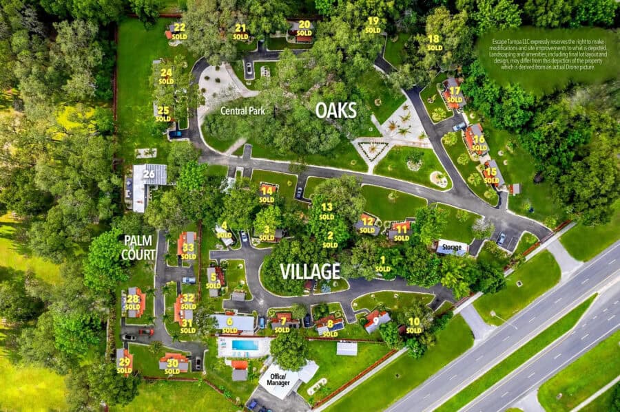 Aerial view of Tiny House Village in The Oaks Village, Tampa, showing lot layout and surrounding gre.