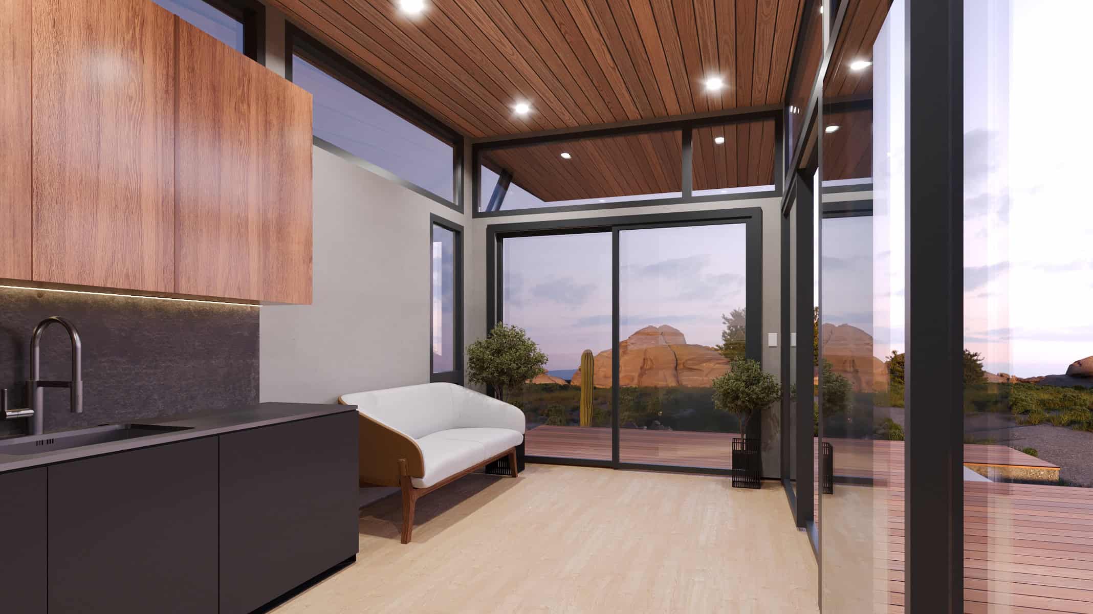 Wheelhaus Lookout interior: kitchen and living toward glass wall at dusk, wood-slat ceiling, black cabinets